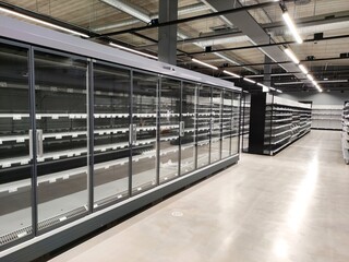 New shop equipment, refrigerators and freezers and shelves in a new supermarket