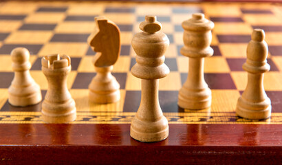 Chess game, board and wooden pieces.