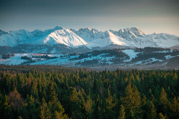 Snowy Tatra mountains in the rays of sunset.