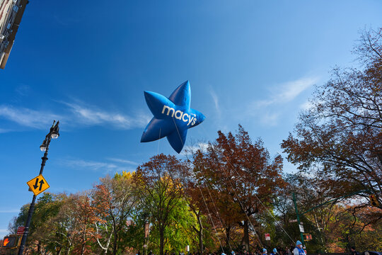 Blue Macy's Star Balloon shown during Thanksgiving Parade in new York City