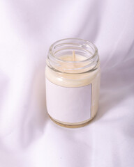Scented candle with lighting aroma for home decoration on white background