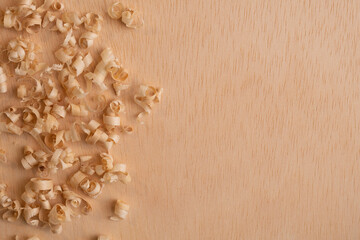 Wood chips and wood spirals on wooden background