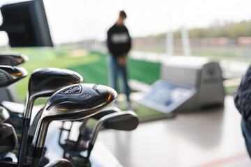 Iron Golf clubs with numbers in modern golf course. Top golf.