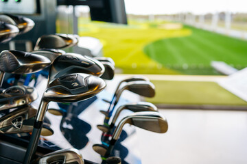 Iron Golf clubs with numbers in modern golf course. Top golf.