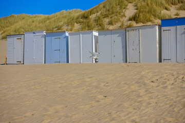 Fototapeta na wymiar Little beach cabins at a North Sea
