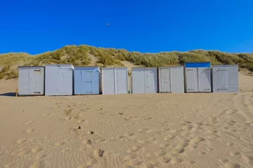 Foto auf Leinwand Little beach cabins at a North Sea © Vincent Andriessen