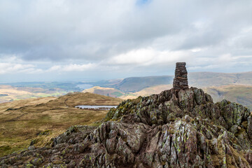 The trig point on the top of Place Fell, in Cumbria