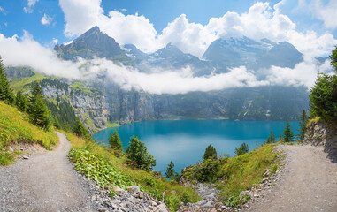 Fototapeta na wymiar stunning mountain landscape lake Oeschinensee, bernese alps hiking trail switzerland