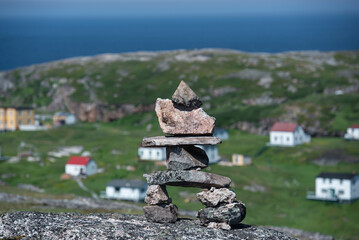 Inukshuk overlooks Battle Harbor  in Newfoundland and Labrador