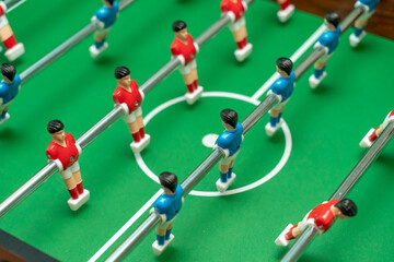 Red and blue foosball players, selective focus. Board games