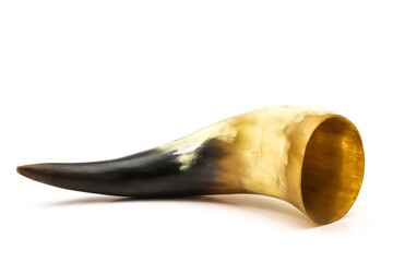 Souvenir horn for drinking wine on a white background. Close-up