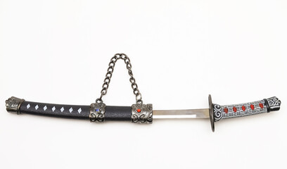 Souvenir dagger on a white background. Close-up