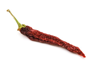 Dried red pepper on a white background. Close-up