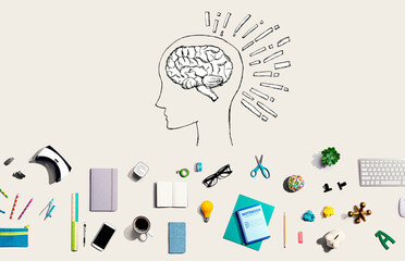 Brain illustration with collection of electronic gadgets and office supplies
