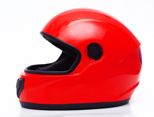 Car helmet in red color on a white background. Close-up