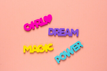 Color inspirational words: girl, power, magic, dream on a bright pink background