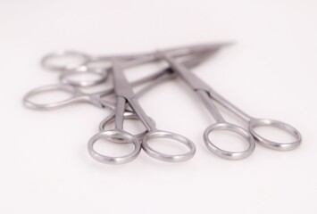 Bunch of surgical scissors on a white background ,shallow depth of field image.