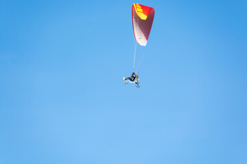 paraglider on the blue sky background