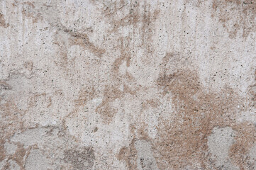 Texture of old dirty concrete brown gray painted wall with cracks closeup