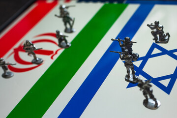 The concept of the economic and political crisis between Israel and Iran, toy soldiers attacking...