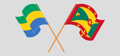 Crossed and waving flags of Gabon and Grenada