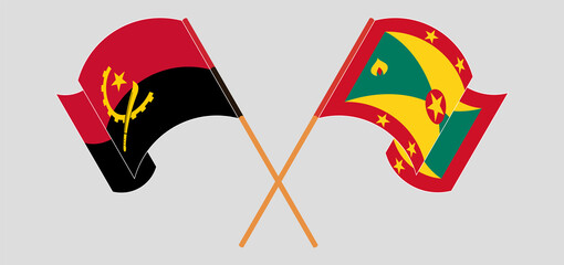Crossed and waving flags of Angola and Grenada
