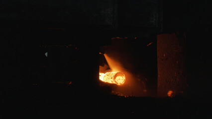 Red hot steel metal billets after molten steel casting, heavy metallurgy concept. Scene. Background of the blacksmith and metallurgical industry. © Media Whale Stock