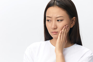 Gumboil Dental abscess Toothache Broken Tooth. Unhappy crying suffering tanned beautiful young Asian woman touch cheek at home interior living room. Injuries Poor health Illness concept. Cool offer