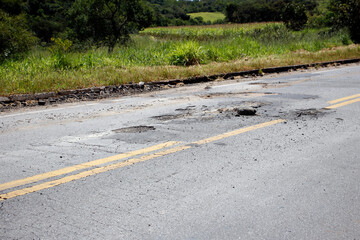 highway with damaged asphalt unsuitable for driving