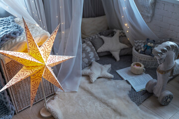 Childen's room corner with a beautifully decorated play tipi tent. Wigwam
