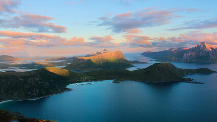 Sunset over blue fjords and mountains in Lofoten Norway