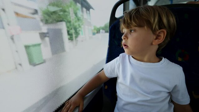 Child traveling by bus passenger kid inside public transportation