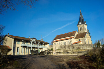 Obraz premium The Saint Didier church and the old town hall and school (mairie, école) of Rignat, Ain, France.