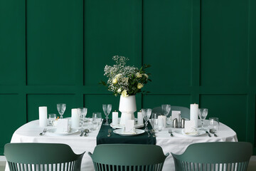 Stylish table setting for wedding celebration in dining room