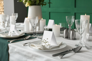 Stylish table setting for wedding celebration in dining room