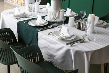 Stylish table setting for wedding celebration in dining room