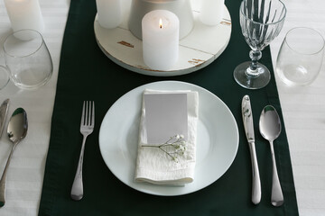 Stylish table setting for wedding celebration with invitation card