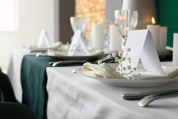 Stylish table setting for wedding celebration in dining room