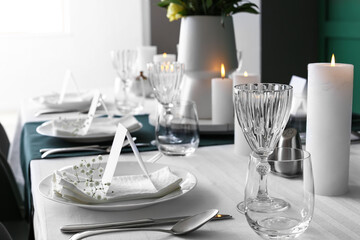Stylish table setting for wedding celebration in dining room