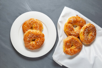 Rings with sesame seeds on grey background, top view. Gluten-free homemade pastry