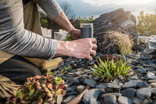 Landscaping Worker Installing LED Garden Outdoor Light