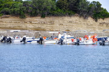 Motor boats with life jackets for tourists at sea resort