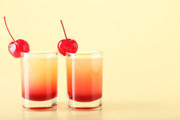 Tasty Pineapple Upside Down Cake Shots on beige background, closeup