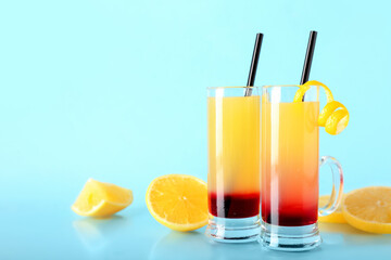 Tasty Pineapple Upside Down Cake Shots on blue background, closeup