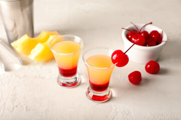 Tasty Pineapple Upside Down Cake Shots on light background