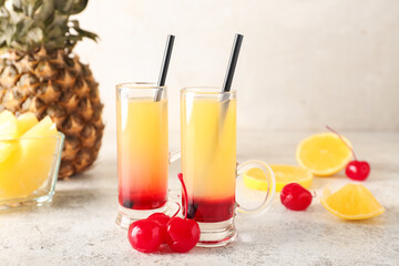 Tasty Pineapple Upside Down Cake Shots on light background