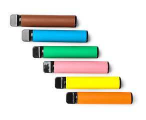 Different disposable electronic cigarettes on white background