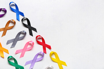 Set of awareness ribbons on light background. World Cancer Day