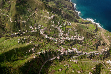 Aerial drone view of the village near the ocean coast and mountains in Anaga Rural Park, Tenerife, Canary Islands.