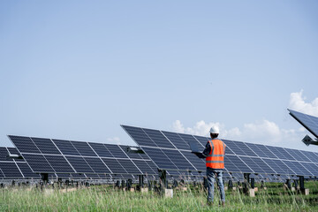 The solar farm(solar panel) with engineers check the operation of the system, Alternative energy to...